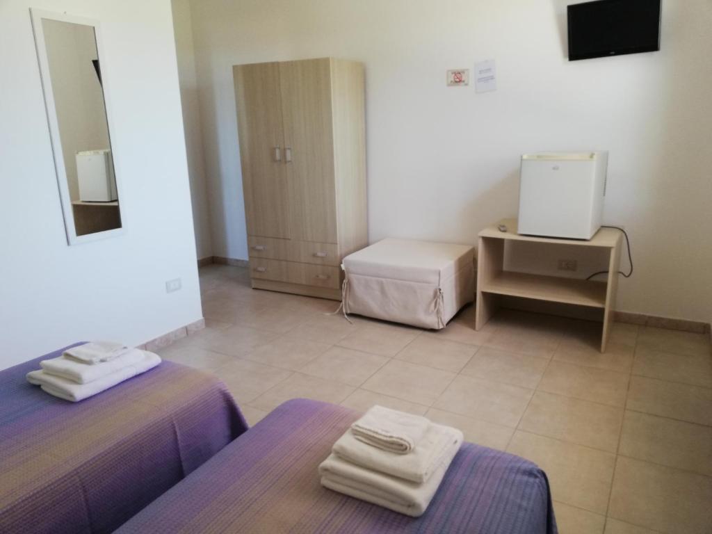 Postel nebo postele na pokoji v ubytování SOLE&MARE agriturismo solo camere