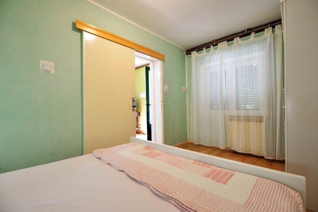 Postel nebo postele na pokoji v ubytování Apartment Zena