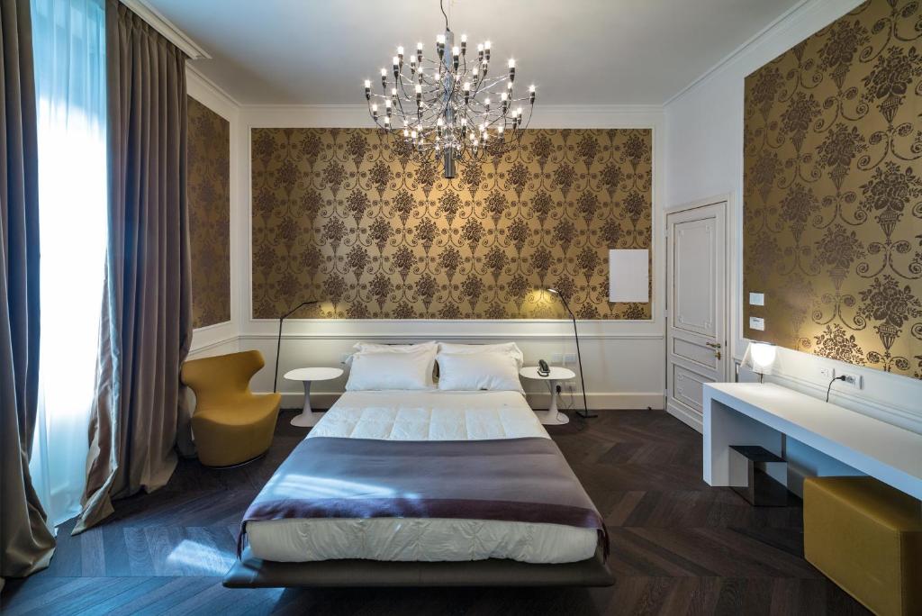 Postel nebo postele na pokoji v ubytování Relais Metelli