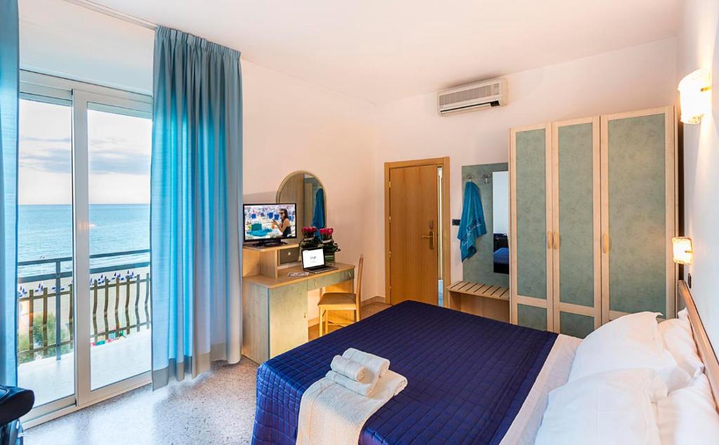 Postel nebo postele na pokoji v ubytování Hotel Excelsior