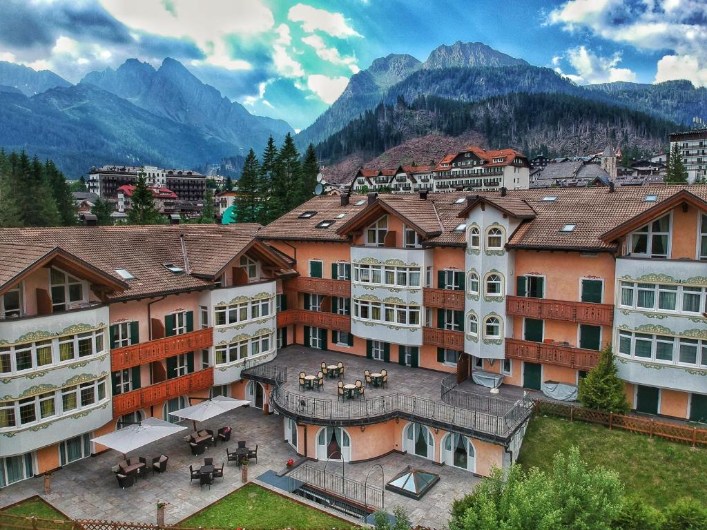 a large building with a view of a city at Residence Pez Gajard in San Martino di Castrozza