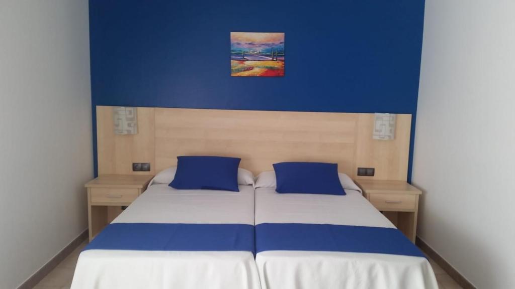 A bed or beds in a room at Hotel Rias Baixas