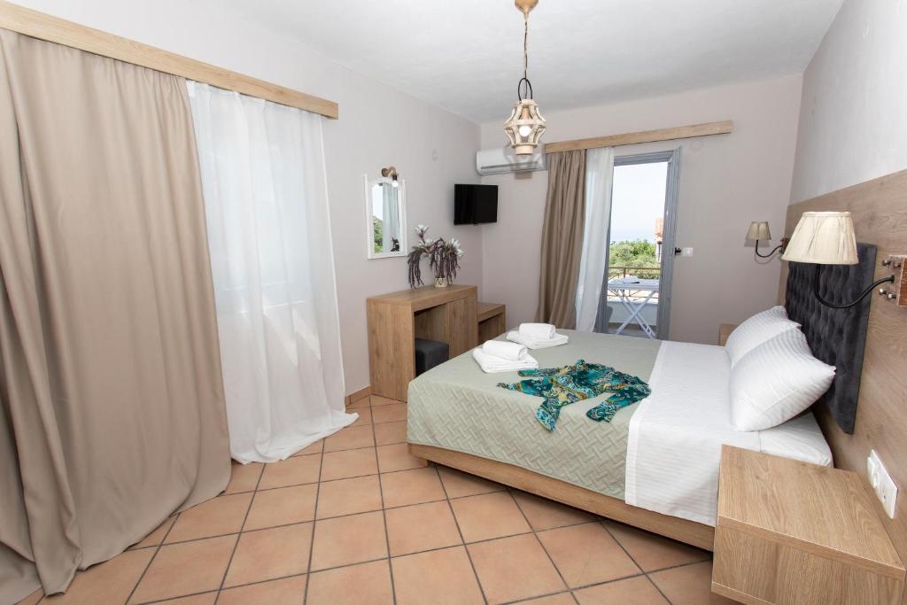 Postel nebo postele na pokoji v ubytování Caretta - Caretta Hotel