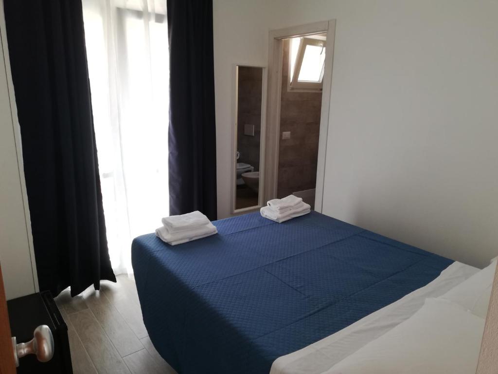 Posteľ alebo postele v izbe v ubytovaní DOMO ALGHERO CENTRO