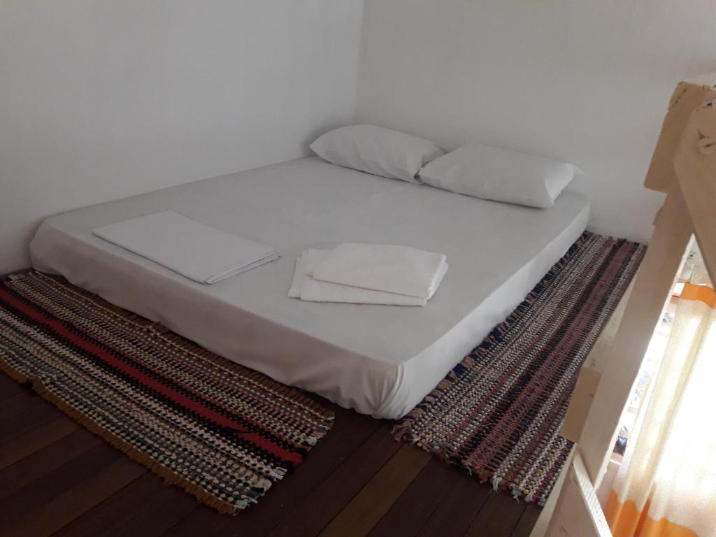 Postel nebo postele na pokoji v ubytování Pousada Veadeiros - Alto Paraiso de Goiás