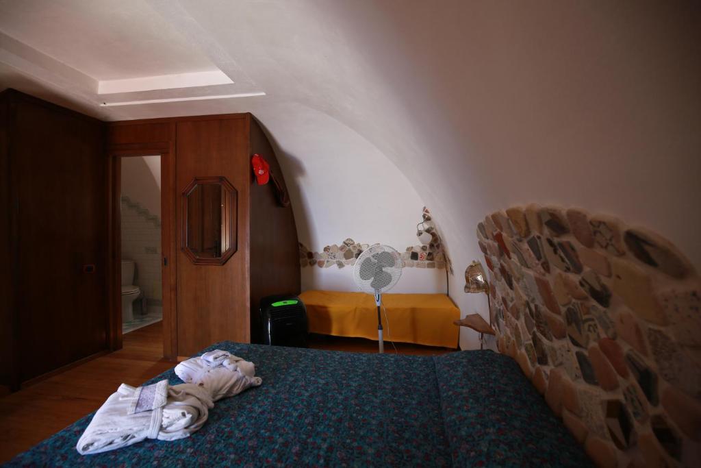 Postel nebo postele na pokoji v ubytování Il Cigno Affittacamere Bed & Breakfast