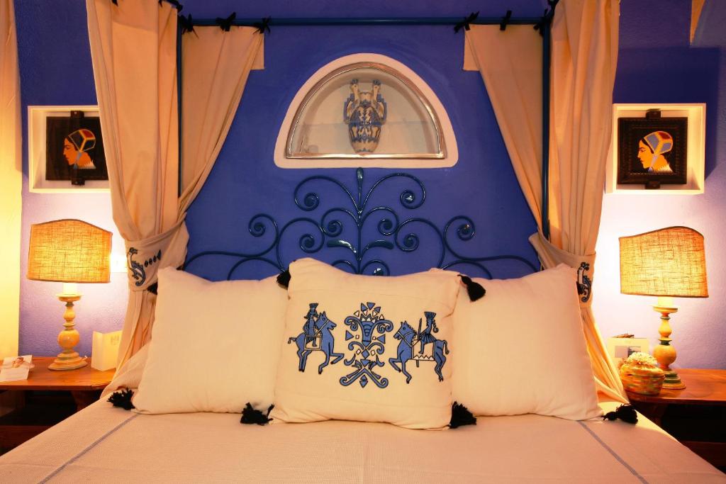 Postel nebo postele na pokoji v ubytování Su Gologone Experience Hotel