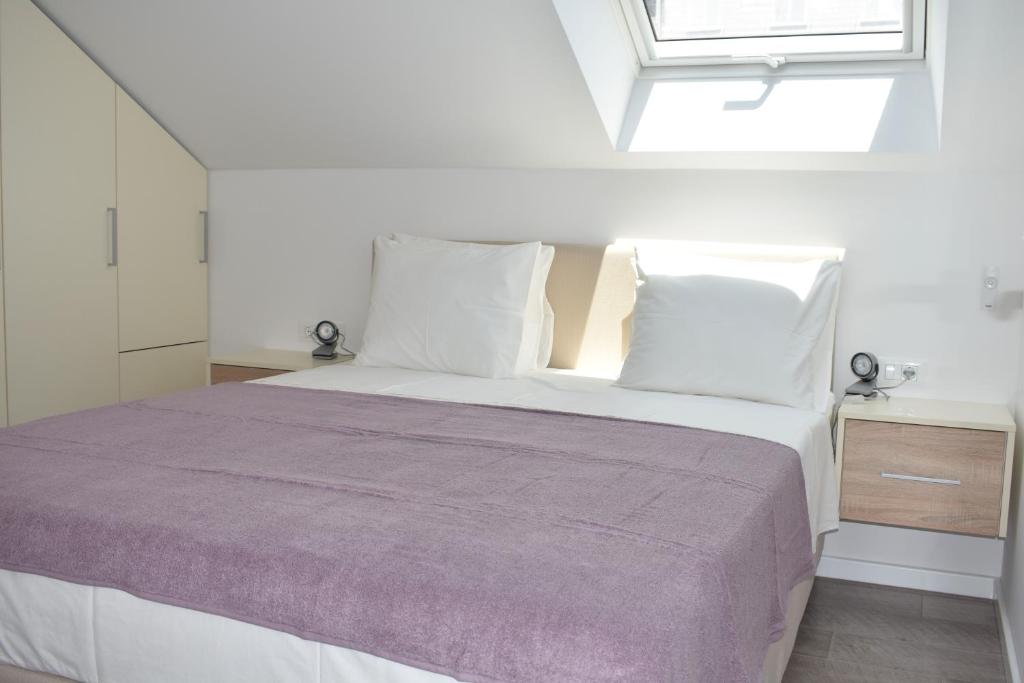 Posteľ alebo postele v izbe v ubytovaní Marlin Apartments