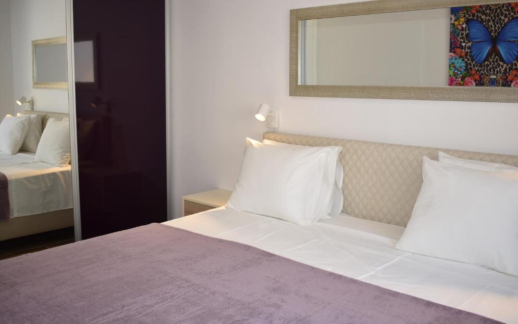 Posteľ alebo postele v izbe v ubytovaní Marlin Apartments