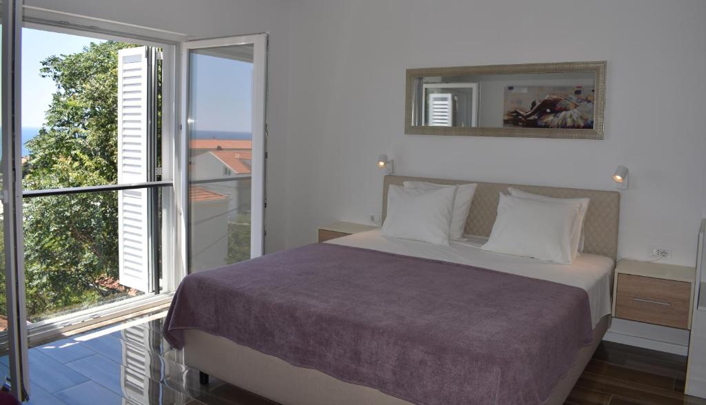 Posteľ alebo postele v izbe v ubytovaní Marlin Apartments