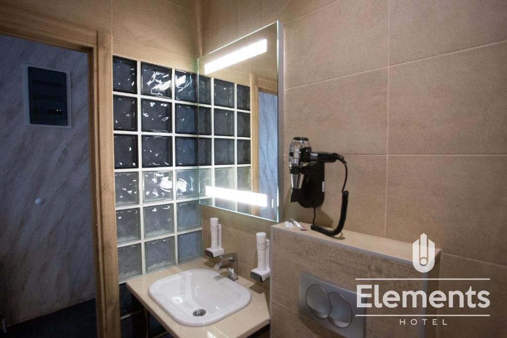 Koupelna v ubytování Hotel Elements