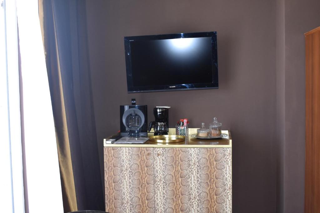 TV a/nebo společenská místnost v ubytování Alto Ver Rooms