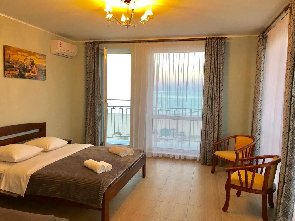 Postel nebo postele na pokoji v ubytování Hotel Golden Beach