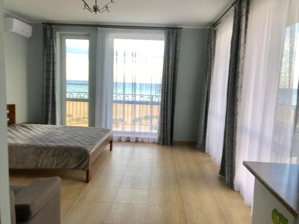 Postel nebo postele na pokoji v ubytování Hotel Golden Beach