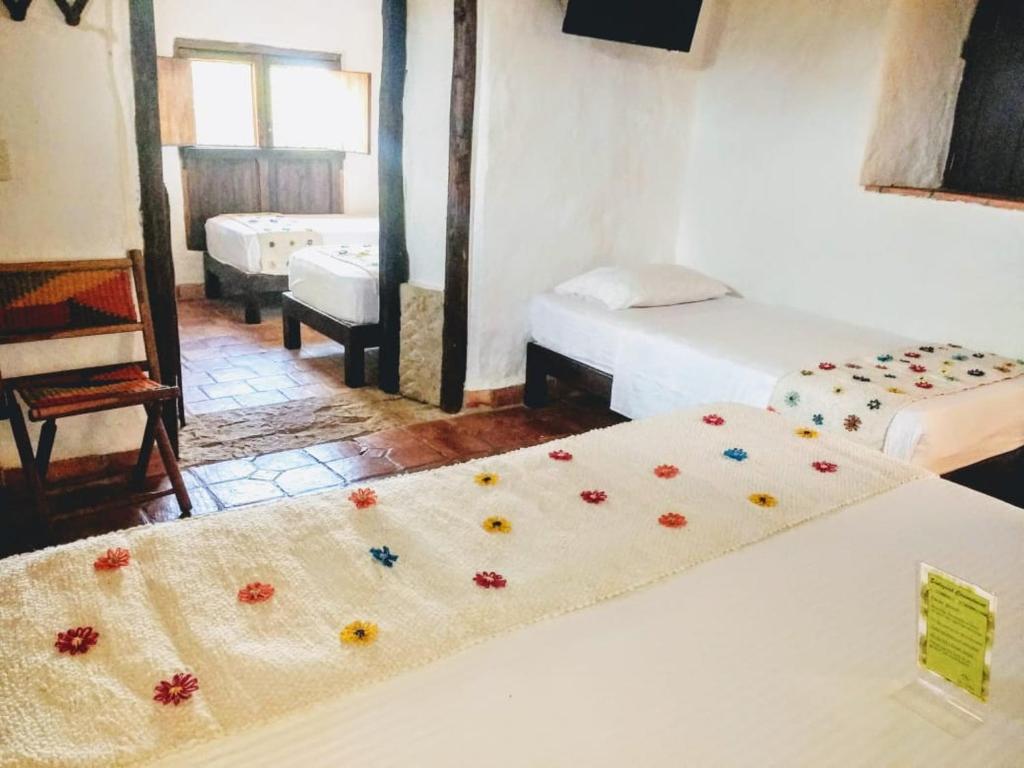 Postel nebo postele na pokoji v ubytování La Loma Hotel Barichara