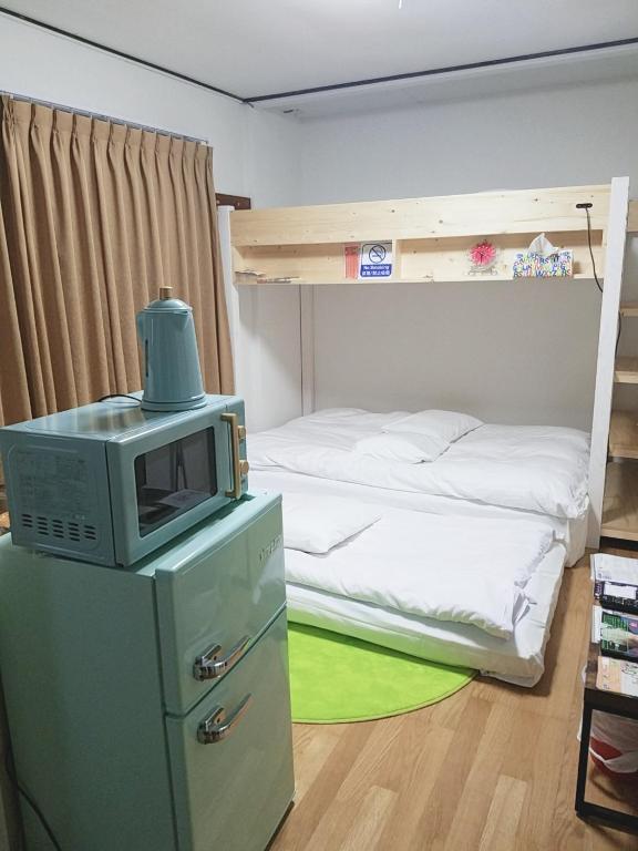 Postel nebo postele na pokoji v ubytování M's Kanazawa