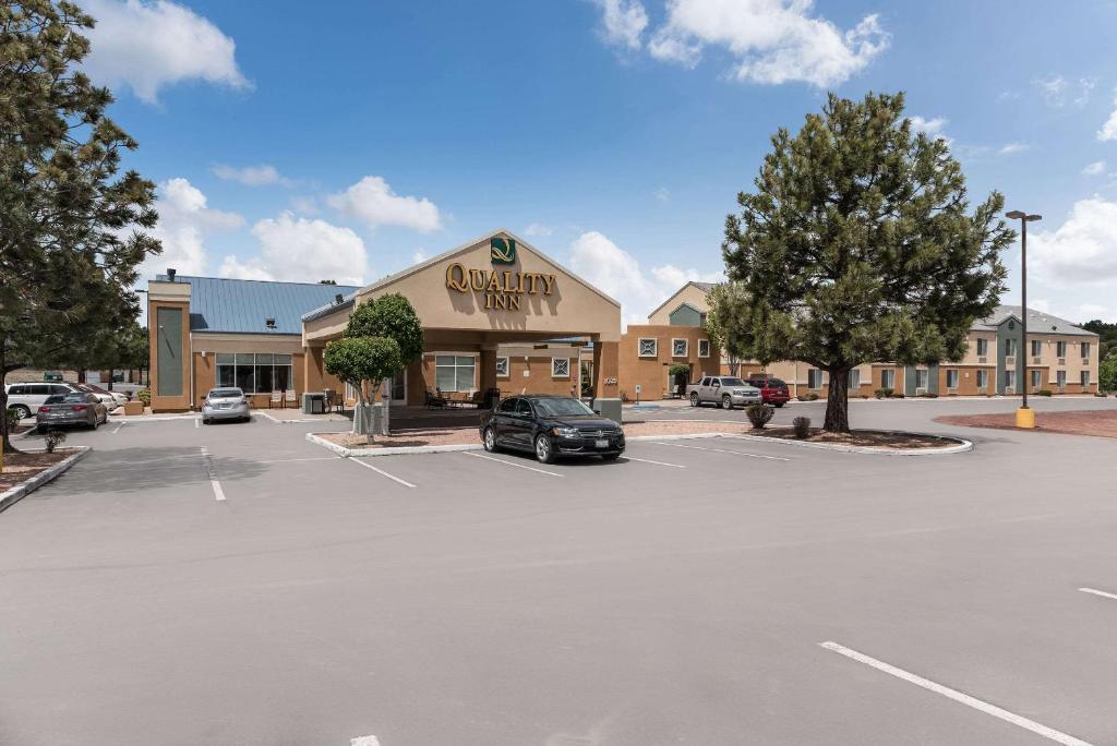 a parking lot in front of a shopping center at Quality Inn Near Grand Canyon in Williams