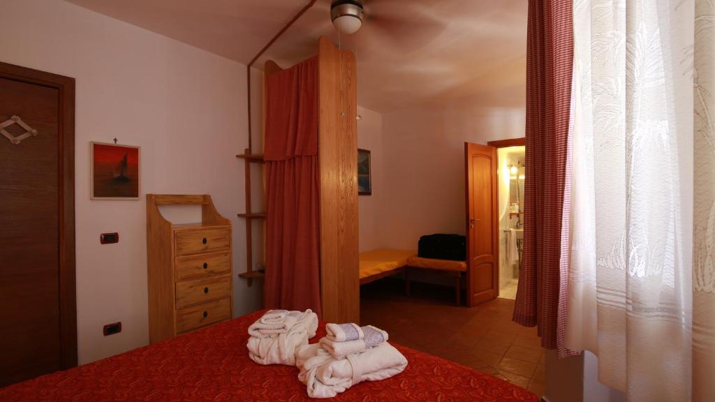 Postel nebo postele na pokoji v ubytování Il Cigno Affittacamere Bed & Breakfast