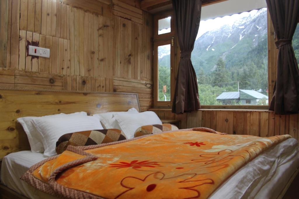 Osiya Shambhu Lodge tesisinde bir odada yatak veya yataklar