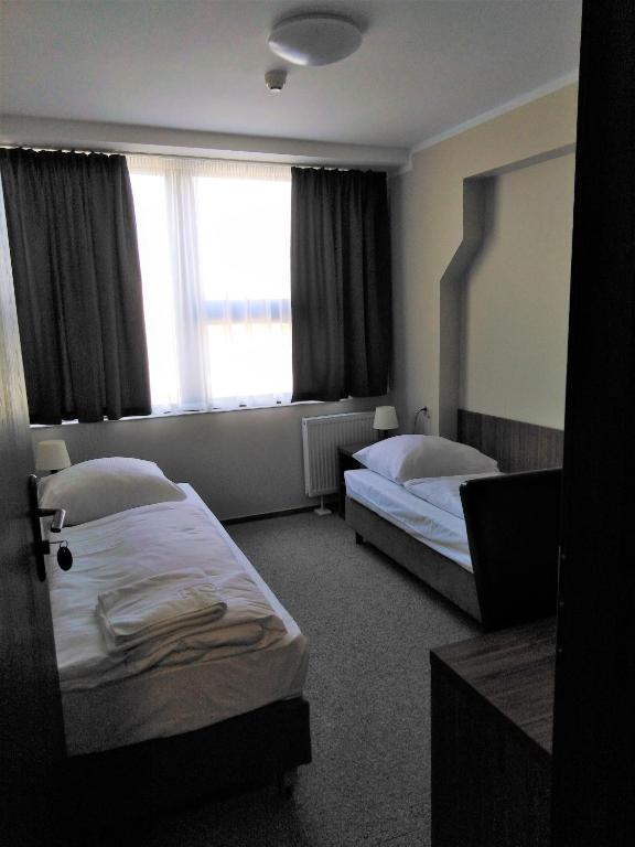 Postel nebo postele na pokoji v ubytování Hotel Cargo