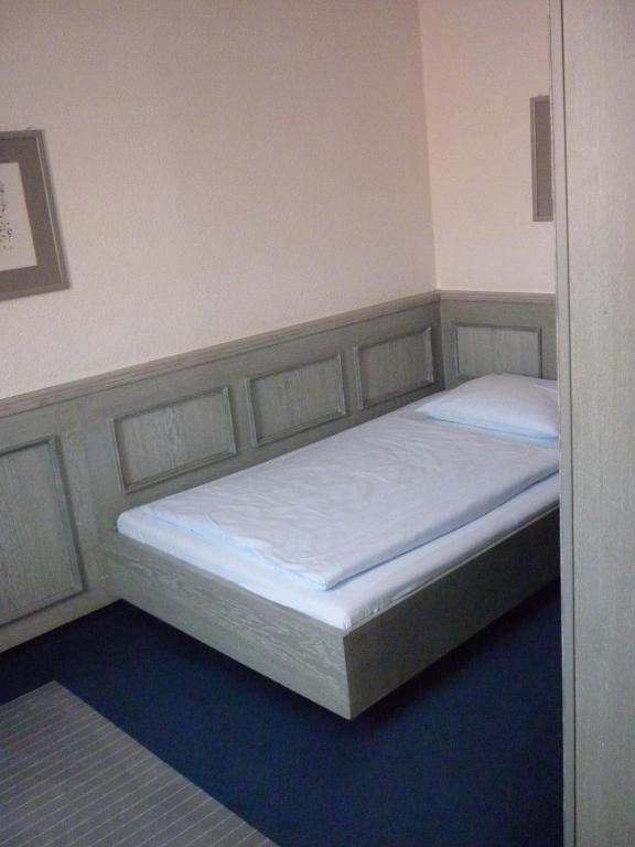 Postel nebo postele na pokoji v ubytování Avenue Hotel