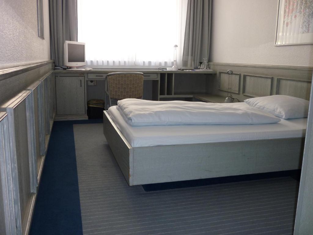 Postel nebo postele na pokoji v ubytování Avenue Hotel