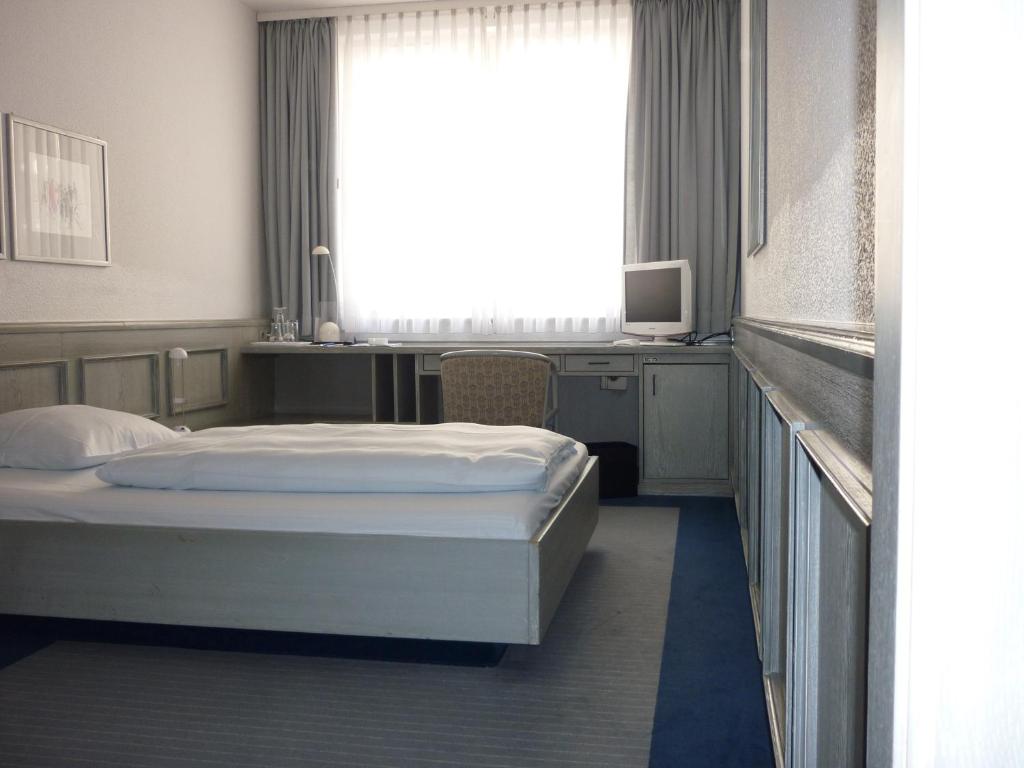 Postel nebo postele na pokoji v ubytování Avenue Hotel