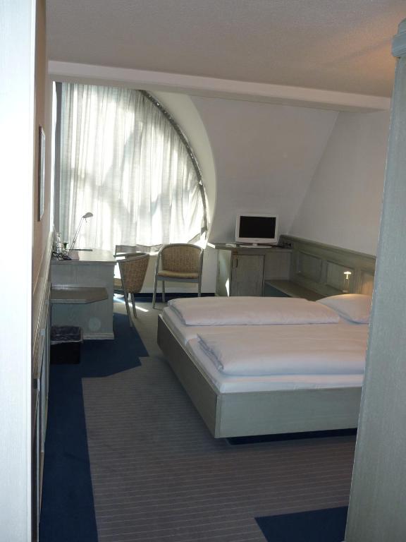 Postel nebo postele na pokoji v ubytování Avenue Hotel
