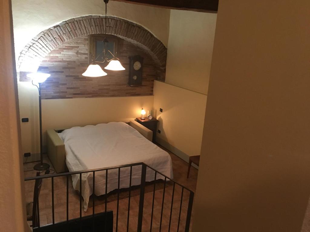 Postel nebo postele na pokoji v ubytování Loft De' Riccardi