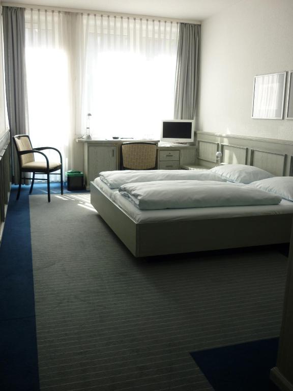 Postel nebo postele na pokoji v ubytování Avenue Hotel