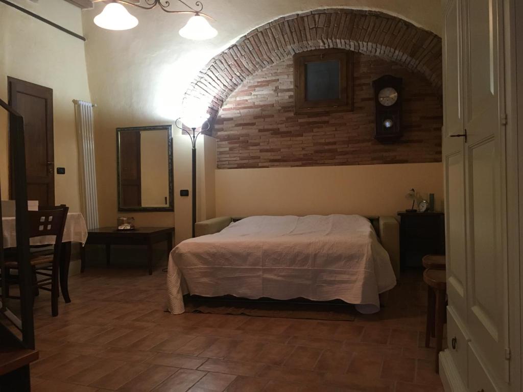 Postel nebo postele na pokoji v ubytování Loft De' Riccardi