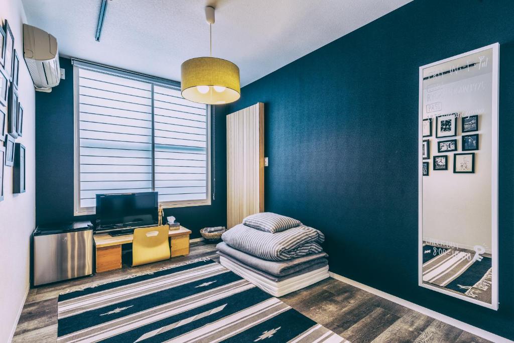 TV a/nebo společenská místnost v ubytování Ogawa Ryokan