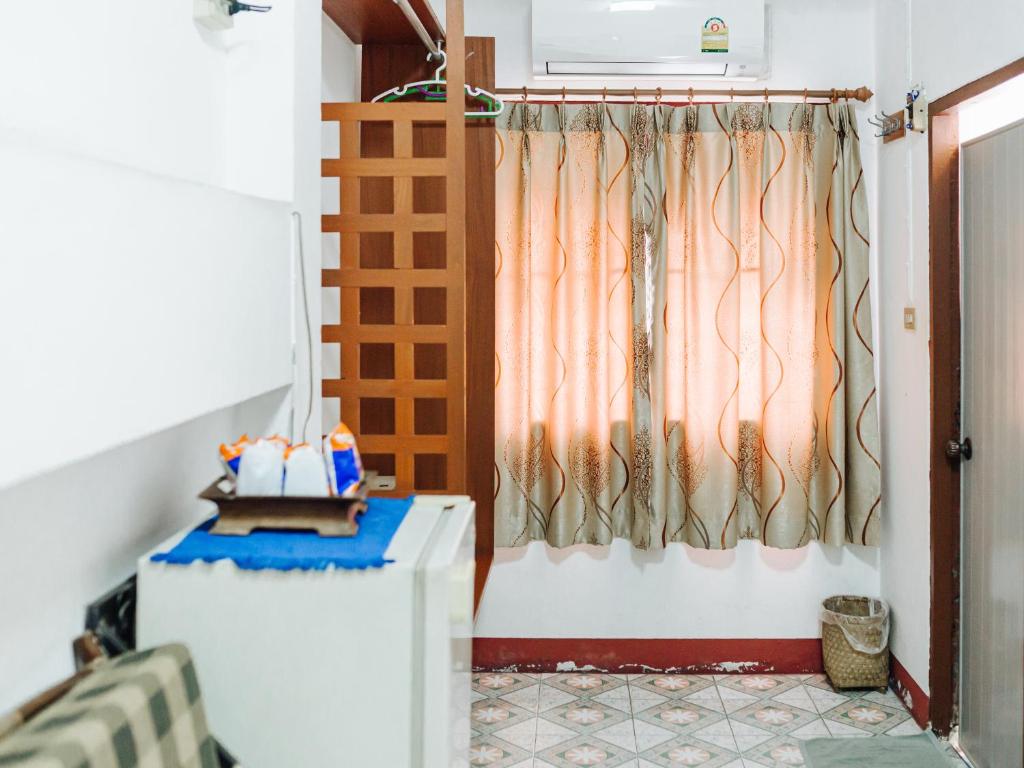 Postel nebo postele na pokoji v ubytování Rendezvous Oldtown Chiangmai