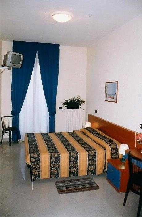 Cama o camas de una habitación en Hotel Greco