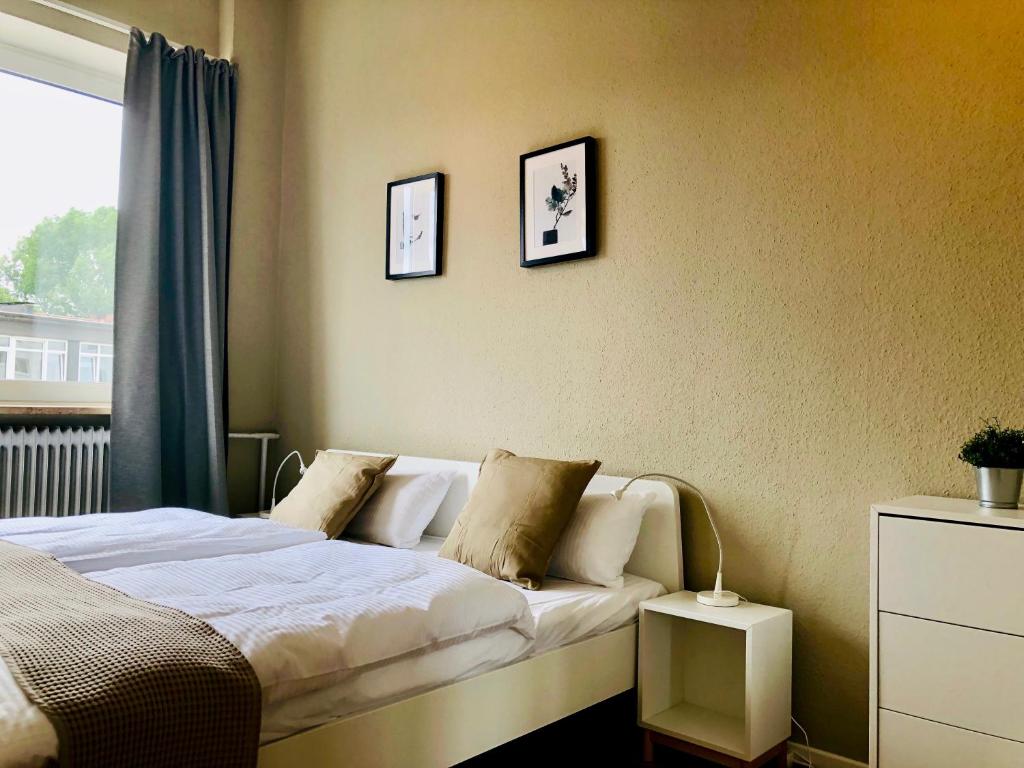 Postel nebo postele na pokoji v ubytování Arbio I Cube Studios & Apartments St Pauli