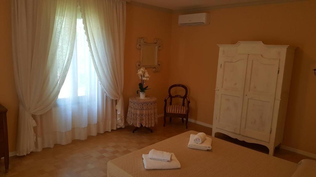 Postel nebo postele na pokoji v ubytování B&B Villa Fiorini