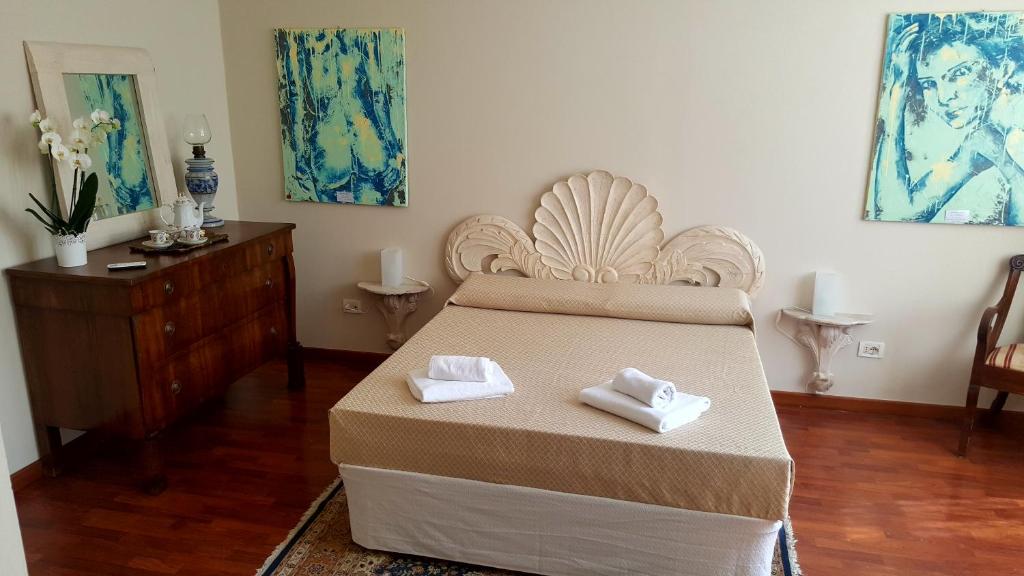 Postel nebo postele na pokoji v ubytování B&B Villa Fiorini