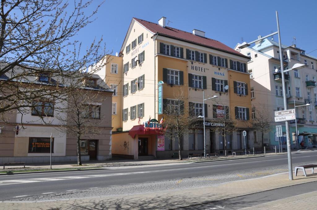 a yellow building on the side of a street at Wellness Hotel Haná in Mariánské Lázně