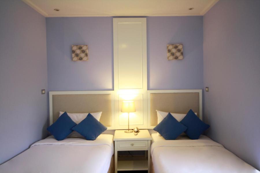 Postel nebo postele na pokoji v ubytování Hotel Alley