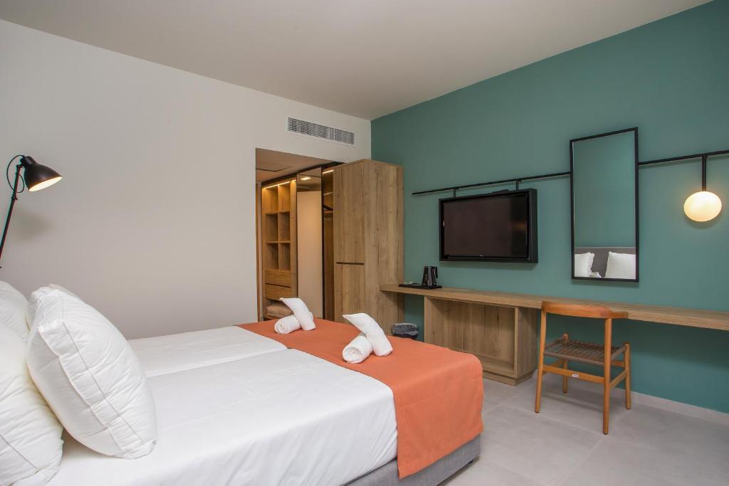 Posteľ alebo postele v izbe v ubytovaní Mazoren Art Hotel