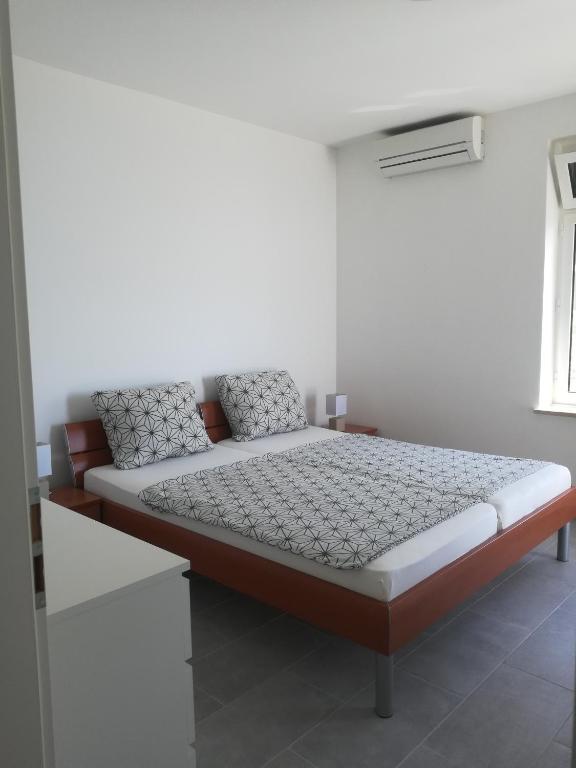 Postel nebo postele na pokoji v ubytování Villa Adagio Apartments