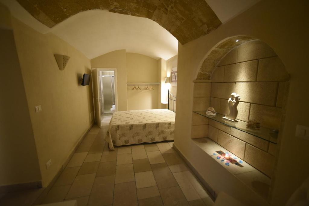 Łóżko lub łóżka w pokoju w obiekcie B&B Corte Cantalupi