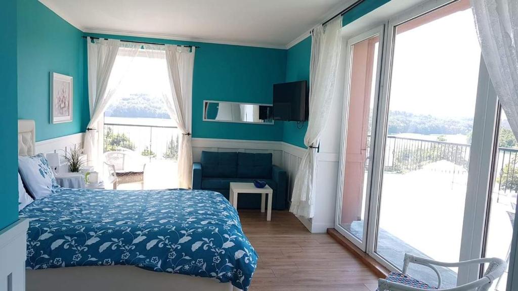 Postel nebo postele na pokoji v ubytování Pensjonat nad jeziorem Lakeside