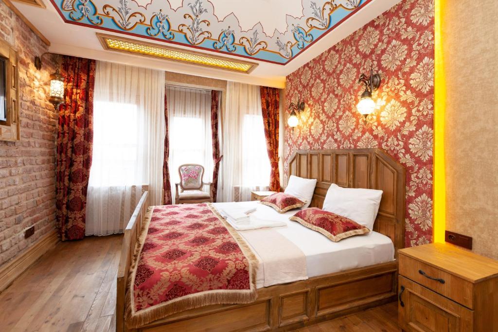 Postel nebo postele na pokoji v ubytování Enderun by Otantik Suites