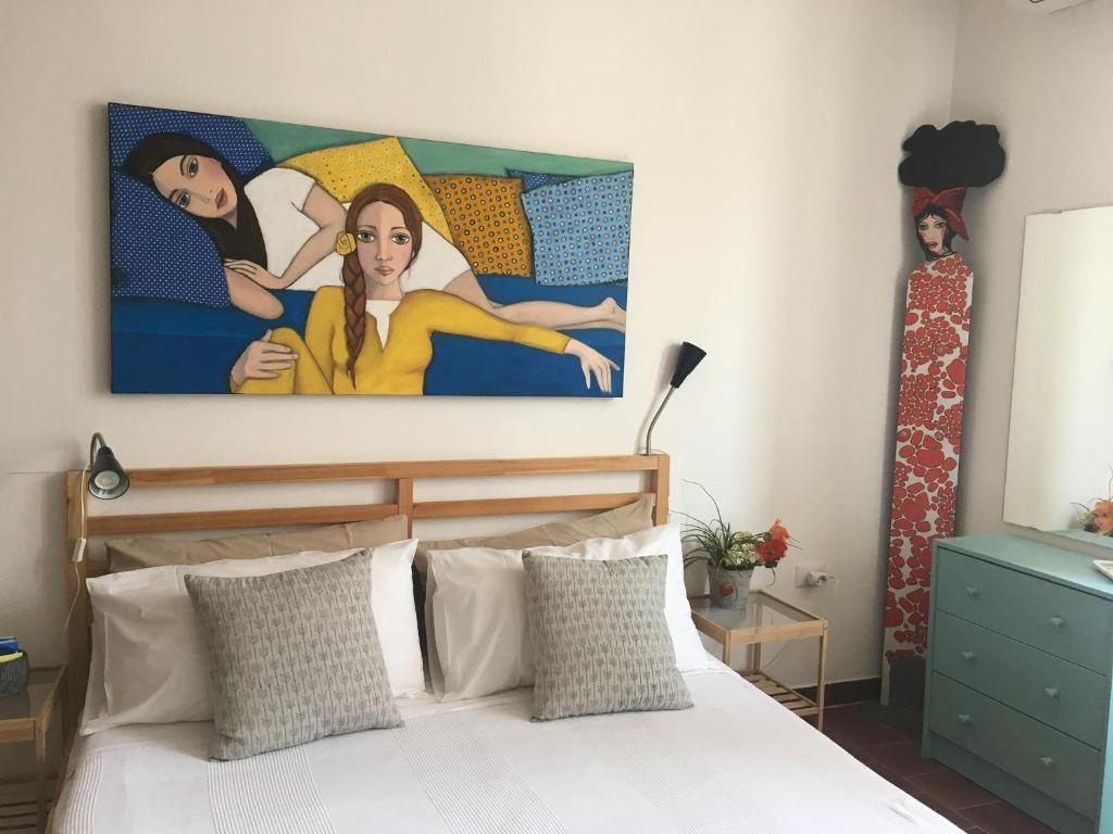 Postel nebo postele na pokoji v ubytování 4 in piazza