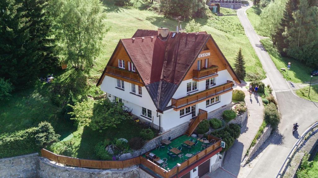 an overhead view of a house with a red roof at Pension Fuka in Špindlerův Mlýn