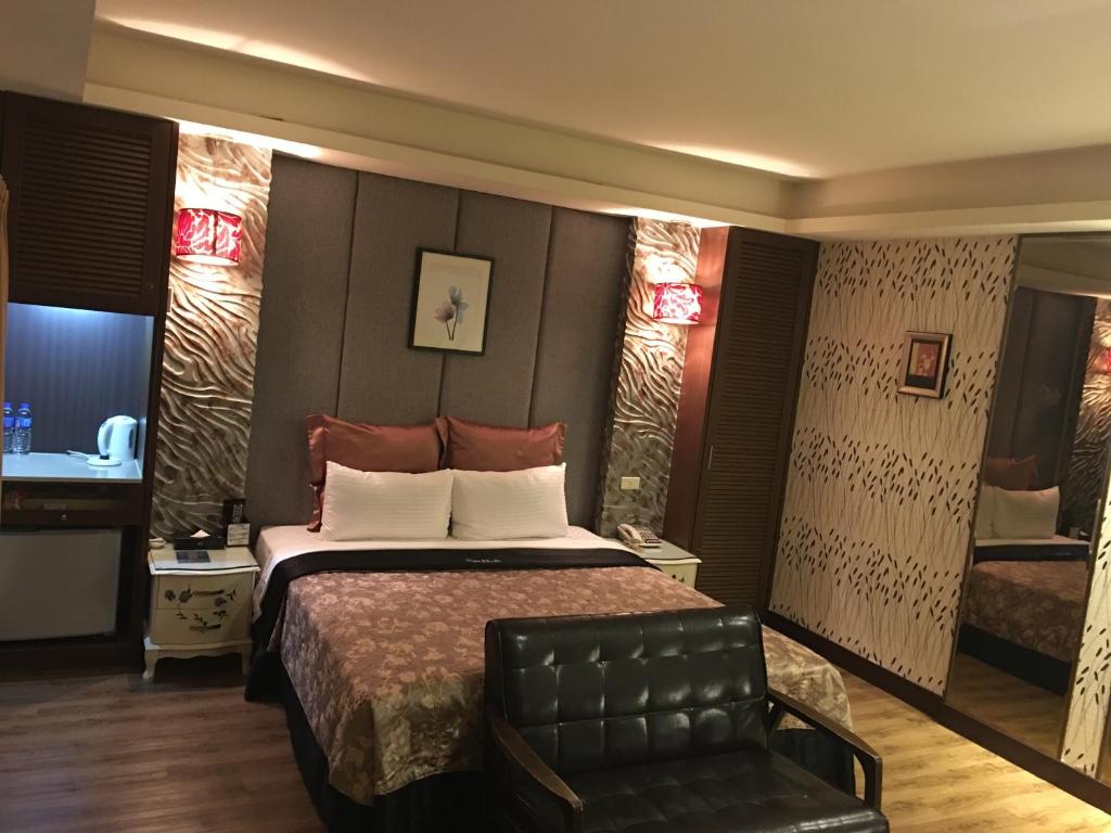 Postel nebo postele na pokoji v ubytování Discovery Motel - Tucheng