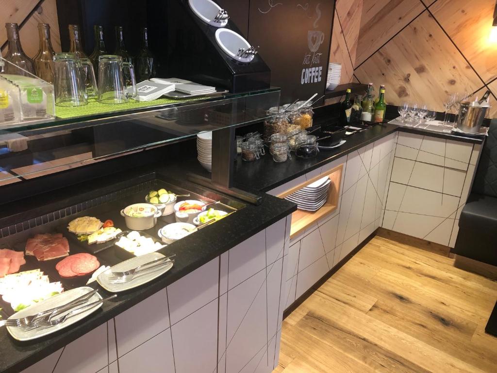 Kuchyň nebo kuchyňský kout v ubytování Hotel & Restaurant Herzstück Waldkirchen