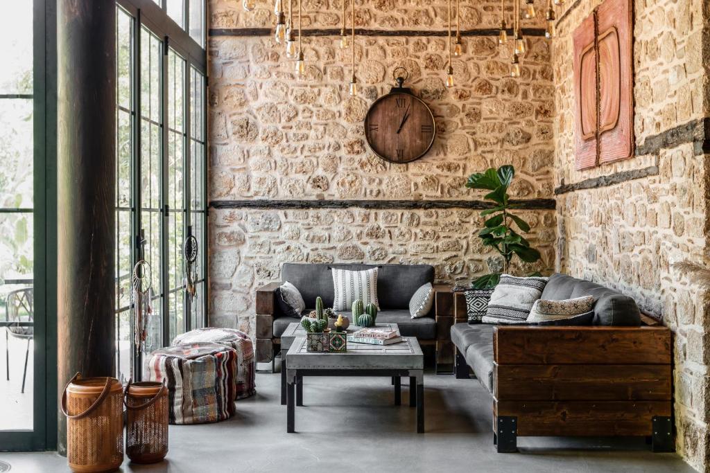 a living room filled with furniture and a large window at Casa Sur Antalya in Antalya