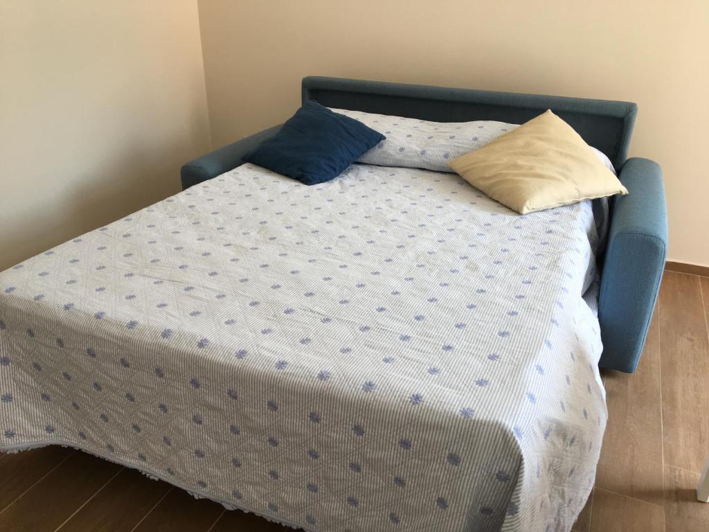 Łóżko lub łóżka w pokoju w obiekcie A Casa di Clara